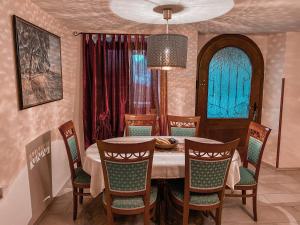 a dining room with a table and chairs at Holiday Home Istra in Plomin