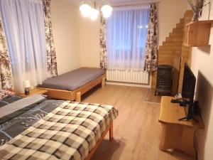 Postel nebo postele na pokoji v ubytování Dom na Krzemienicy