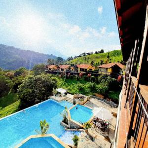 a view of a resort with two swimming pools at LoMar Sol&Luna in Sasaima