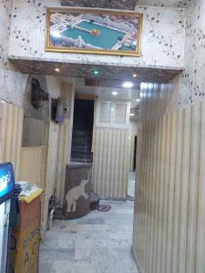 a room with a painting of a pool on the ceiling at MJ Chawla Homestay double bed attached bathroom room in Amritsar