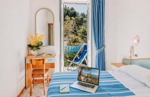 Postel nebo postele na pokoji v ubytování Hotel Bagnitiello