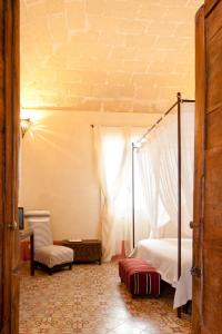 Tempat tidur dalam kamar di La Casa Dell'Arancio