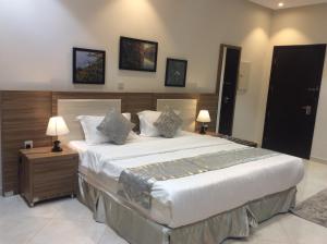 En eller flere senge i et værelse på Admire Apart' Hotel