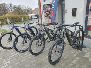 three bikes parked next to each other outside a store at Apartament u Makosi in Bystrzyca Kłodzka