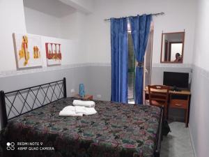 Postel nebo postele na pokoji v ubytování Hotel Alloggio Del Conte