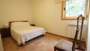 a small bedroom with a bed and a window at River house in Vila Nova Cerveira in Vila Nova de Cerveira +81 photos