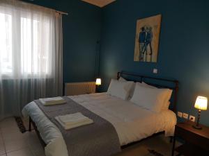A bed or beds in a room at "Vasiliki" Home