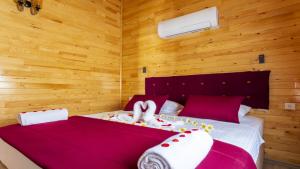 Postel nebo postele na pokoji v ubytování MARTI BUNGALOW