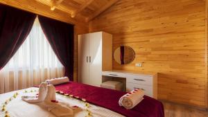 Postel nebo postele na pokoji v ubytování MARTI BUNGALOW