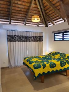 Voodi või voodid majutusasutuse Moorea Lodge toas