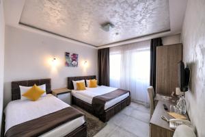 Voodi või voodid majutusasutuse Garnet Hotel & Event Centar toas