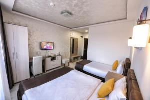 Voodi või voodid majutusasutuse Garnet Hotel & Event Centar toas