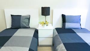 En eller flere senger på et rom på Piscina privada - V3 - Internet Fibra