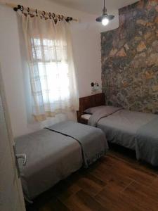 Ένα ή περισσότερα κρεβάτια σε δωμάτιο στο Apartman Gradac Deguric