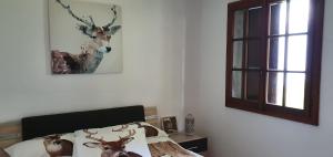 A bed or beds in a room at Ferienwohnung Rustico ai Monti