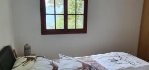 A bed or beds in a room at Ferienwohnung Rustico ai Monti