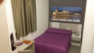 A bed or beds in a room at Terrazze Villanova