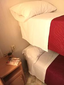 Voodi või voodid majutusasutuse Sunseabeach toas