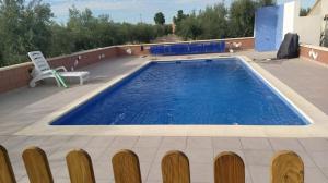 Bazén v ubytování Cortijo La Torre de Caniles nebo v jeho okolí