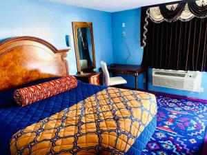 Postel nebo postele na pokoji v ubytování A Fisher's Inn Motel