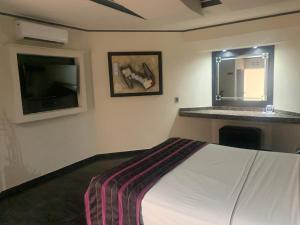 Postel nebo postele na pokoji v ubytování Motel Xcaret + 9 fotografií