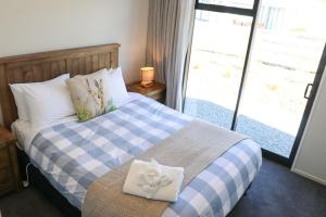Llit o llits en una habitació de Fivestone Lodge