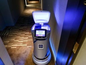 aresso machine sitting on the floor in a hallway at SHIBUYA STREAM HOTEL formerly Shibuya Stream Excel Hotel Tokyu in Tokyo