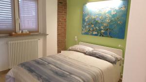 Giường trong phòng chung tại La Tana dei Corgi