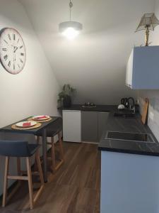 Kuchyň nebo kuchyňský kout v ubytování Apartament Muzyczny