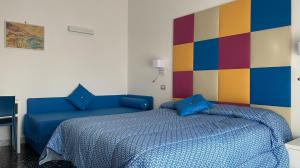 Postel nebo postele na pokoji v ubytování B&B Vittoria