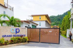 a gate with a sign in front of a building at Villa Luxe AP06 in Kamala Beach