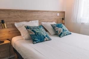 Postel nebo postele na pokoji v ubytování Hotel du Cap