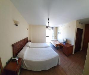 Postel nebo postele na pokoji v ubytování Hotel Casa Beletri