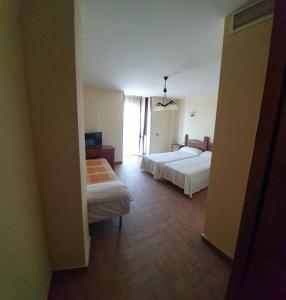 Postel nebo postele na pokoji v ubytování Hotel Casa Beletri