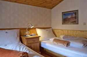 Postel nebo postele na pokoji v ubytování Haberlhof