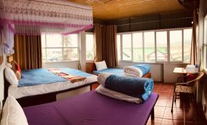 Postel nebo postele na pokoji v ubytování Meo Vac Cosy Hostel