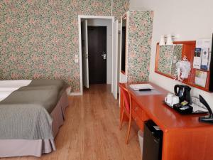 Voodi või voodid majutusasutuse Hotel Lorensberg toas