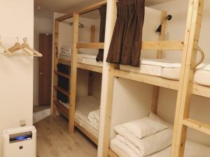 Postel nebo postele na pokoji v ubytování Guest House Yadomaru + 37 fotografií