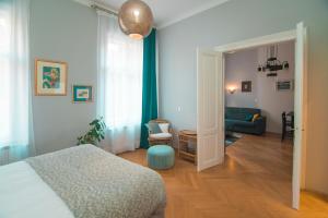 Postel nebo postele na pokoji v ubytování Stross Apartments