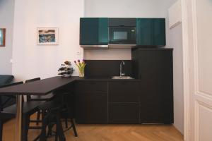 Kuchyň nebo kuchyňský kout v ubytování Stross Apartments