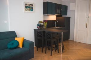 Kuchyň nebo kuchyňský kout v ubytování Stross Apartments