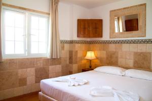 Postel nebo postele na pokoji v ubytování Aparthotel Maracaibo + 8 fotografií
