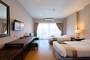 Green Lake Resort - SHA Extra Plus Certified客房内的一张或多张床位