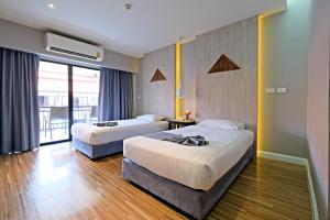 Green Lake Resort - SHA Extra Plus Certified客房内的一张或多张床位