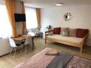a living room with a couch and a table at Ferienhaus Elisabeth in Füssen