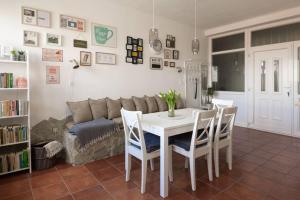 a living room with a table and a couch at Hygge Apartman in Győr