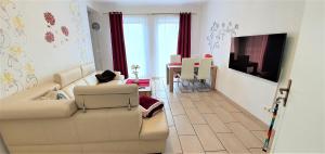 a living room with a couch and a table at Fewo Traum in Neppermin