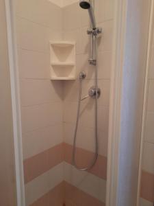 a shower with a shower head in a bathroom at TERRAZZA SUL MARE in Marotta