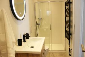 a white bathroom with a sink and a shower at THE VIEW in Pučišća +23 photos
