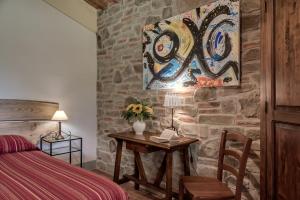 Postel nebo postele na pokoji v ubytování Villa Bellaria Lucignano